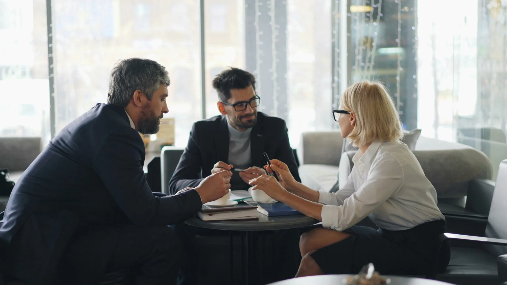 A couple discussing their home financing plans at a table